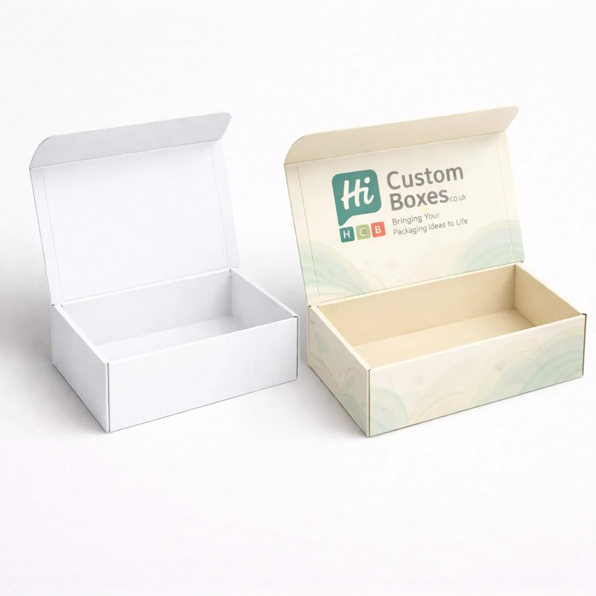 Pair of open corrugated cardboard boxes- displaying a clean white interior and a branded lid- class=